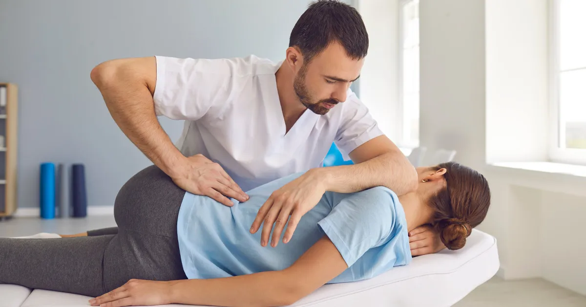 female patient getting her first chiropractic treatment at kinesis rehab whitby, ontario