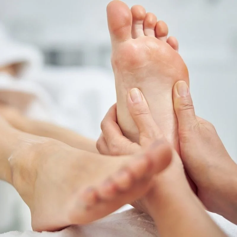 chiropodist performing foot massage and assessment at Whitby rehabilitation clinic