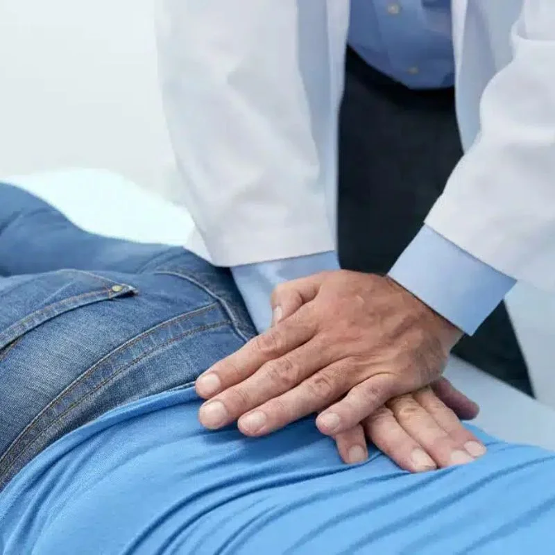 chiropractor applying spinal adjustment for sciatica pain in Whitby