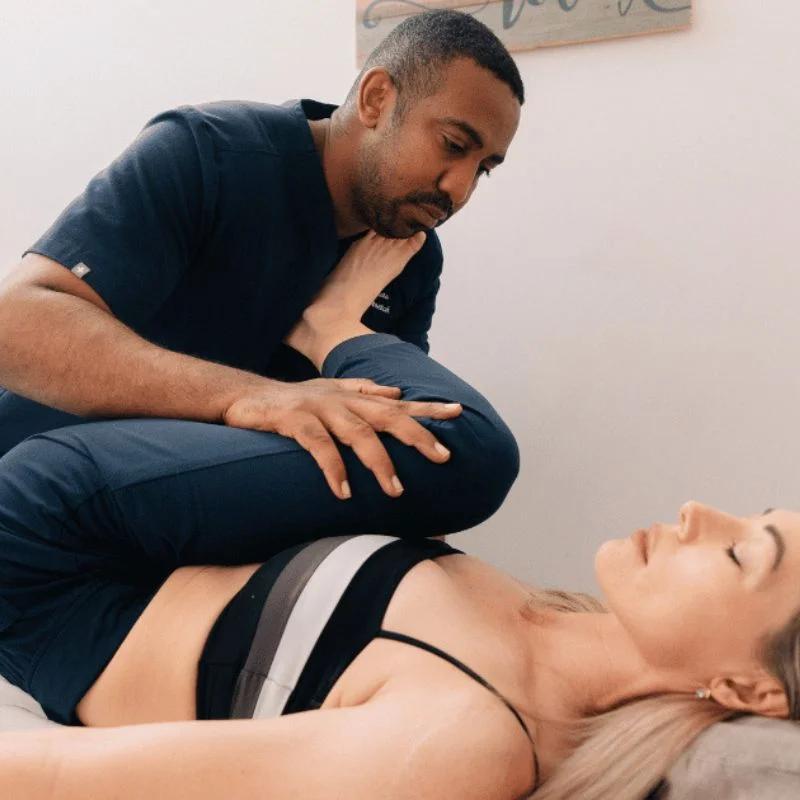 kinesiologist performing upper body fascia stretch therapy session in Whitby clinic