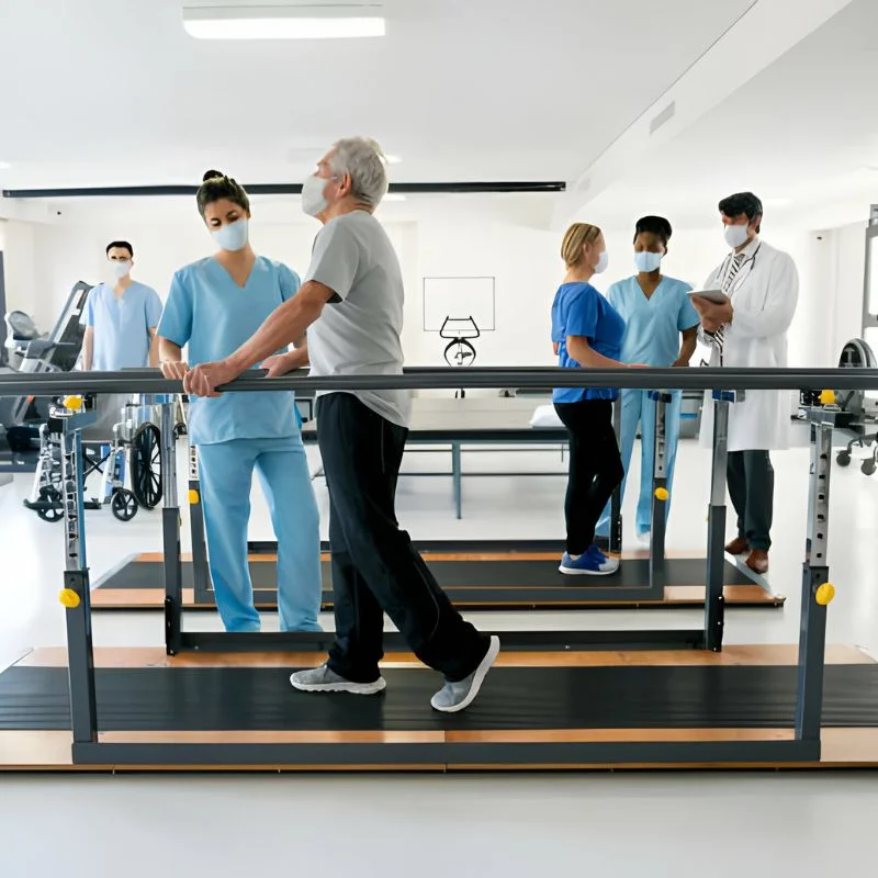 multidisciplinary rehabilitation team supporting senior patient with walking exercise in Whitby clinic