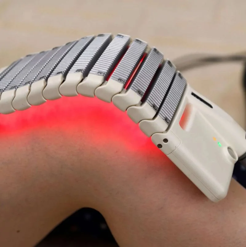 Bioflex laser therapy flexible pad applied to patient knee joint for rehabilitation in Whitby